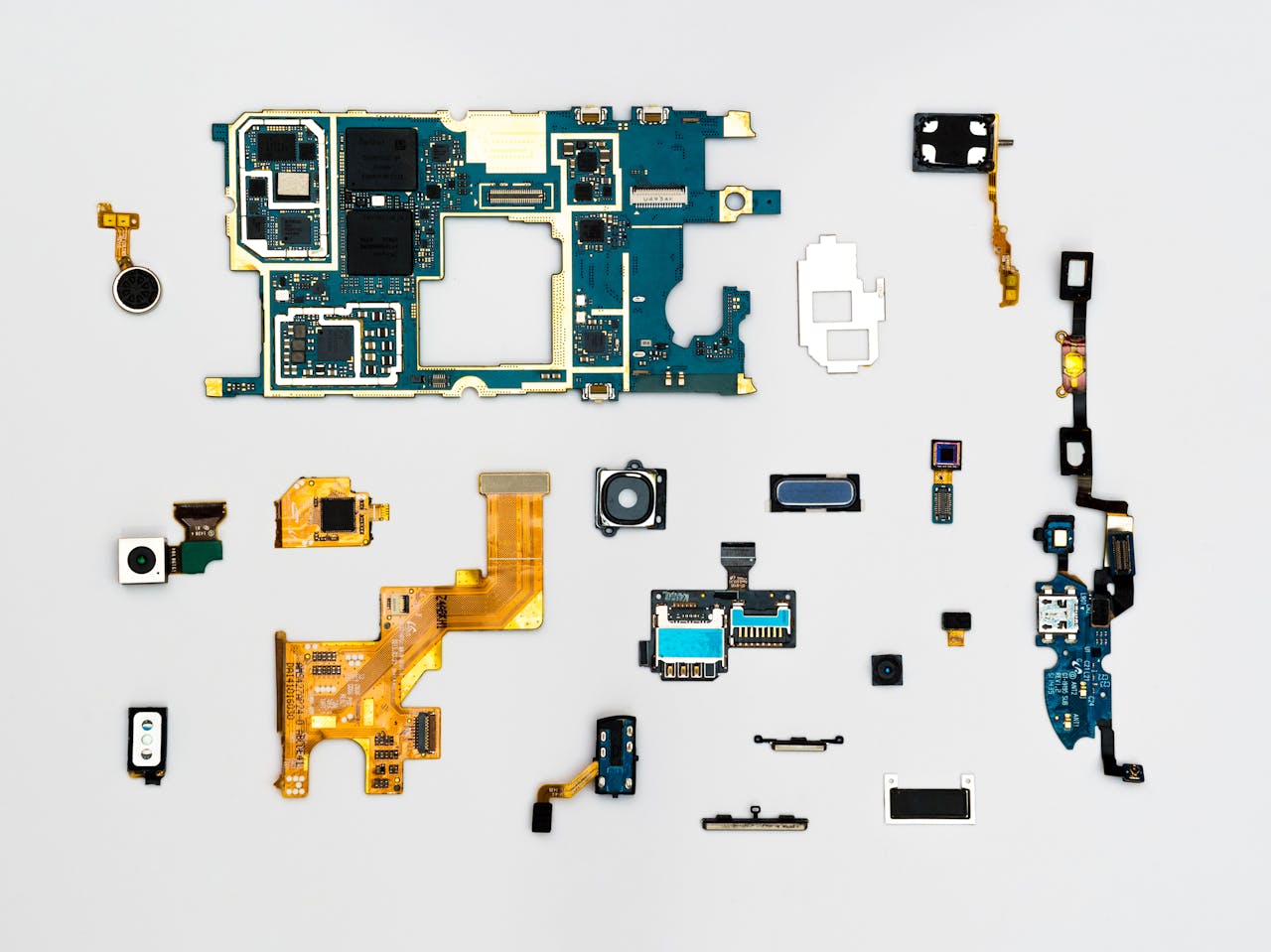 services-02 Exploded view of smartphone components showcasing intricate technological design.